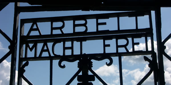 The teasing Arbeit Macht Frei sign at the entrance to KZ-Gedenkstatte Dachau (Dachau Concentration Camp)