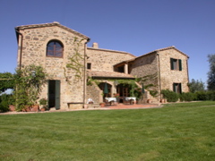 The stone farmhouse of Il Poderuccio, an agriturismo near Montalcino in Tuscany.
