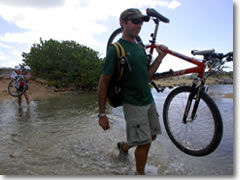 La Dulce Vida owner Karl Husson leads the way across a stream on Vieques