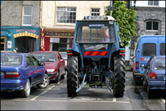 A tractor parked in a town square in Ireland