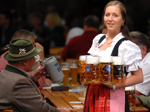 Serving liter-sized mugs of beer in the beer garden of Munich's the Hofbraühaus