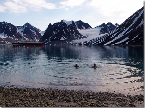 I go swimming at 79°33'55"N in 37°F water—and, yes, there was an actual polar bear on the far side of the fjord—in the Magdalenafjord, Spitsbergen, Svalbard, Arctic Norway  