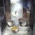 Artifacts excavated from the West Kennet Long Barrow on display at the Wiltshire Museum, Devizes. The items displayed are, from top to bottom: four bone beads; three bead necklaces; a chalk bead and two bone scoops; two Peterborough Ware bowls; four bone pins; a "Windmill Hill bowl"; and four flint scrapers., Salisbury Museum, Salisbury and Stonehenge (Photo by Pasicles)